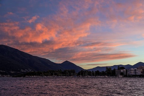 Locarno, Lake Maggiore, clouds coloured by evening light in the background, Canton Ticino,
