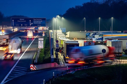 Heavy traffic on the A2 at the Schwarze Heide rest area, Bottrop, overcrowded car park for trucks