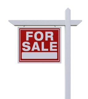 Left facing for sale real estate sign isolated on a white background