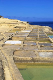 Historic ancient salt pans on coast near Marsalforn, island of Gozo, Malta, Europe