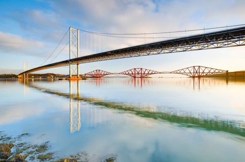 View of the Forth Road Bridge and the red railway bridge Forth Bridge at the Fírth of Forth estuary