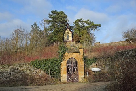Neo-Gothic chapel built in 1890 with archway and stone wall on the hill, Heiligenblut, Alzey,