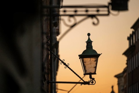 Silhouette of historic street lamp or street lantern in the evening light, nostalgic atmosphere,