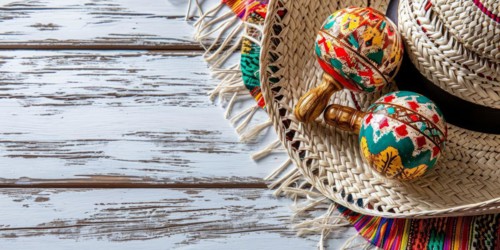 Mexico festive wooden background with sombrero, serape and maracas in flat lay view, AI generated