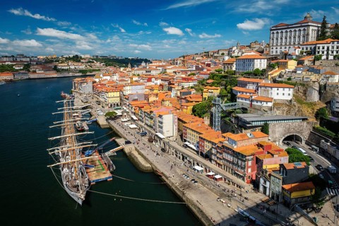 Aerial view of Porto city and Douro river with moored sailling ship from Dom Luis bridge I. Porto,