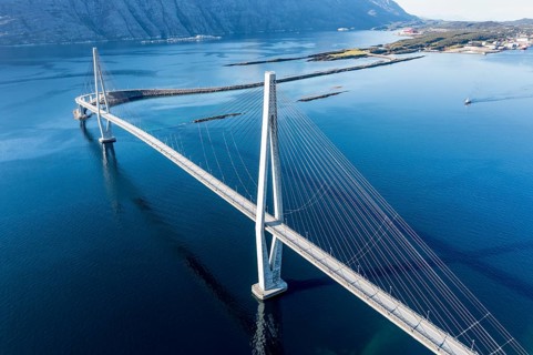 Aerial view of Helgeland bridge, connecting Sandnessjøen with the norwegian mainland, fishing boat