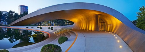 Illuminated Porsche Pavilion in the evening, Autostadt, Volkswagen AG, Wolfsburg, Lower Saxony,