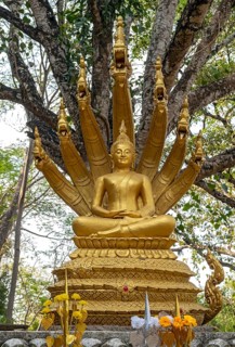 Statue of Mucalinda sheltering Buddha, Phousi or Phu Si Hill, Luang Prabang, Laos, Asia