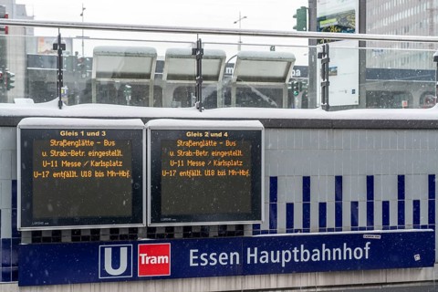 Essen main station, display board informs about cancelled local transport connections, partly full