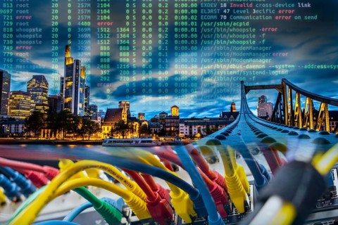 Symbolic image of critical infrastructure, skyline of Frankfurt am Main, data cable, hacker code