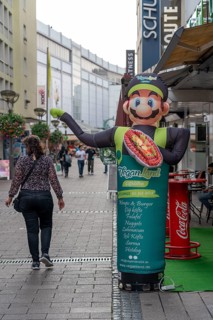 Advertising, figure, for a vegan restaurant, city centre, pedestrian zone, Münzstraße, Duisburg,