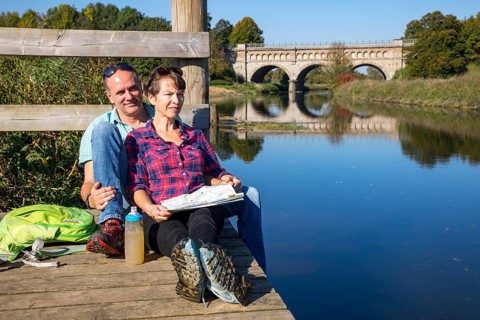 Hikers in the Steverauen Olfen, Alte Fahrt canal bridge, of the Dortmund-Ems Canal, a renaturalised