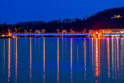 Lake Baldeney, illuminated weir, with lock, left and hydroelectric power plant power station,
