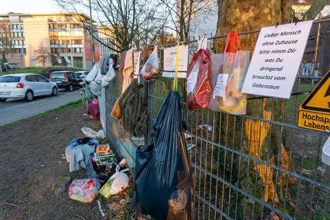 Gift fence with donations for the homeless and needy, food, hygiene articles, clothing, in Essen