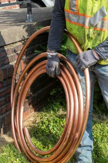 Detroit, Michigan, Workers replace old lead water service lines with copper pipes. Lead is harmful