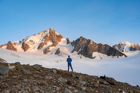 High alpine mountain landscape at sunset, Glacier du Tour, mountaineer in front of glacier and