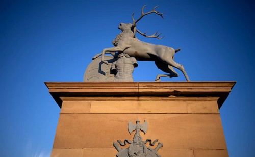 Heraldic stag by Anton von Isopis in front of the main portal and cour d'honneur Neues Schloss,