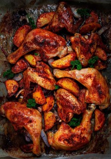 Roast chicken legs with potatoes and onions in the oven, homemade. No people