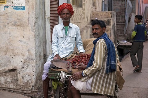Men selling red peppers on street in Bundi, Rajasthan, India, Asia
