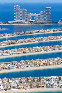 The Palm Jumeirah with Atlantis The Royal Hotel artificial island from above in Dubai, United Arab