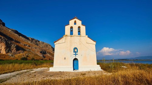 Agiou Petrou Chapel, Chapel of St Peter, Lonely church under a bright blue sky, surrounded by dry