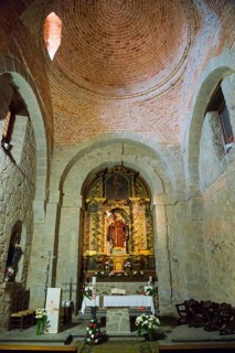 Interior of a church with magnificent altar, stone arches and religious decorations, Santuario de