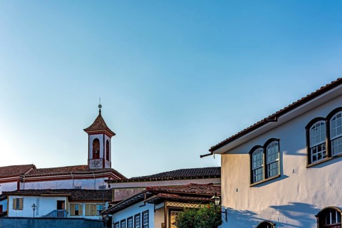 Church tower rising among old colonial houses in the city of Diamantina in Minas Gerais,