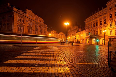 The Lesser Town Square in Prague at night with the tram in a long exposure