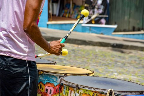 Drummer with colorful drums on the slopes of Pelourinho in the city of Salvador, Bahia, Pelourinho,