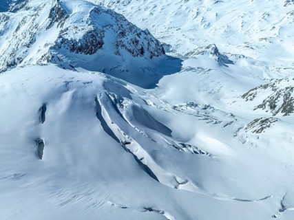 Aerial view, snow-covered mountain landscape, glacier with crevasse on Cevedale, Ortler group,