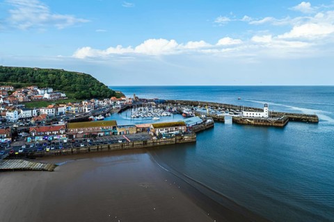 Scarborough Lighthouse and Harbour from a drone, Vincent Pier, Scarborough, North Yorkshire,