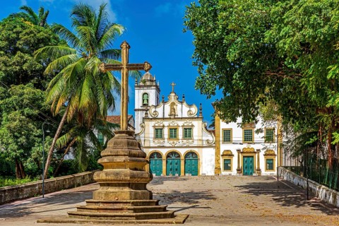 Square with historic baroque church and stone crucifix in Olinda, Pernambuco, Brazil, South America
