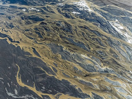Aerial view, glaicial streams flow across Mælifellssandur, black sand desert, Icelandic highlands,