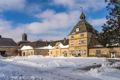 The snow-covered Westerwinkel Castle in winter, Herbern, Ascheberg, Münsterland, North