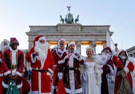 Assembly of Santas and angels of the Berlin Father Christmas Centre at the Brandenburg Tor, Berlin,