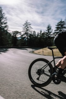 Road bike rider in spring between Lechtal and Tannheimer Tal in front of picturesque scenery of the