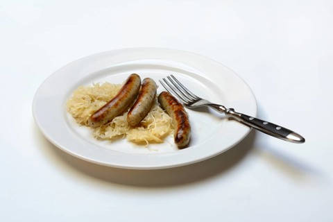 Nuremberg sausages with sauerkraut on a plate, Rostbratwurst, Germany, Europe