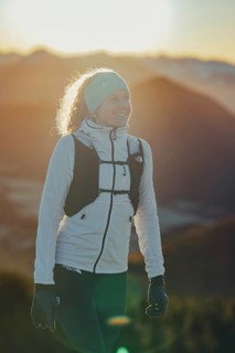 Trail running in autumn on the Jochberg on Lake Walchensee against the wonderful backdrop of the