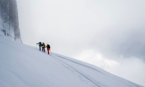 Dramatic atmosphere, Ski tourers, Snowy mountain landscape, Bernese Alps, Bernese Oberland,