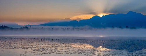 Sunrise at Lake Hopfensee near Füssen, behind Hopfen am See, the Tegelberg massif and the Säuling,