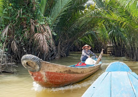 Vietnamese Woman ina rowing boat, Mekong Delta, Vietnam, Asia