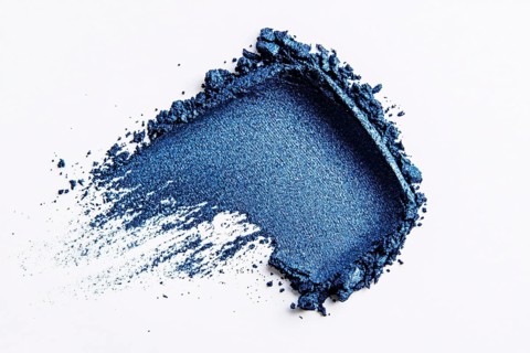 Blue eye shadow makeup swatch on white background. Generative AI, AI generated