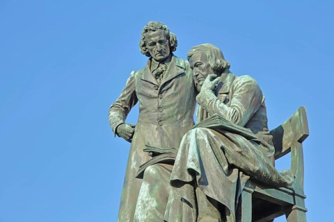 Brothers Grimm national monument, standing Jacob and sitting on the chair Wilhelm, brothers, bronze