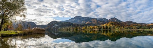 Autumnal mountain landscape with mountain peaks Herzogstand and Heimgarten, reflection in Lake