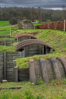 Reconstructed World War One trench with elephant shelters made of corrugated iron near WWI