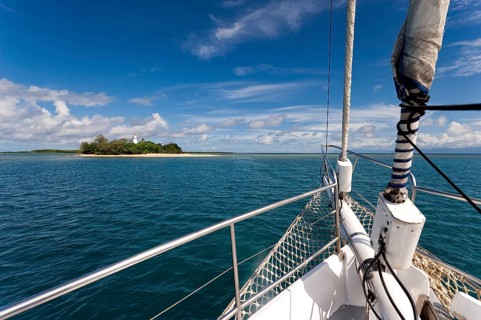 Sailing, sailing ship off uninhabited coral island Low Island near Port Douglas, Barrier reef,