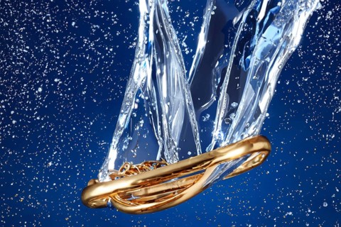 Golden ring falls into the water with splashes, drops and reflections, AI generated