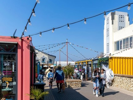 Shops and cafes in converted shipping containers, Beach Street, Felixstowe, Suffolk, England, UK