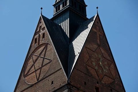 Tower detail of the Marktkirche St. Georgii et Jacobi with hexagram and tower clock, state capital