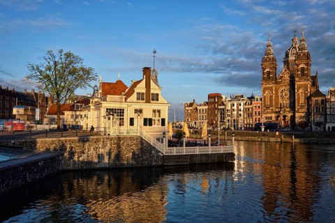 AMSTERDAM, NETHERLANDS, MAY 9, 2017: Tourist information center, Amsterdam canal and Church of